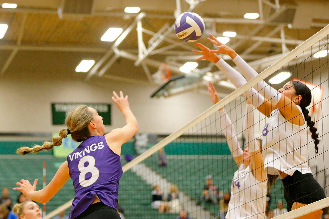 Lake Stevens’ Claire Mackintosh tries to get the ball over two blockers against North Creek during the Wesco 4A district 1/2 championship match Saturday, Nov. 11, 2023, at Henry M. Jackson High School in Mill Creek, Washington. (Ryan Berry / The Herald)