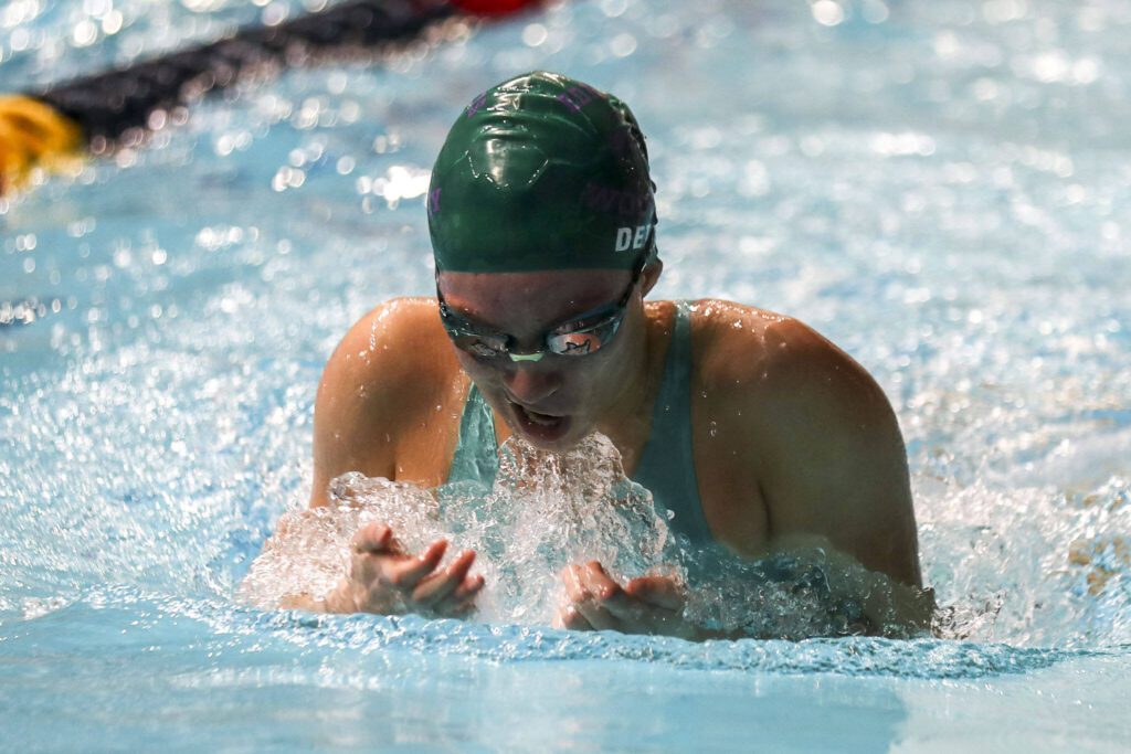 Edmonds-Woodway’s Tatum Detjen races in the 100-yard breaststroke during the 3A girls state swim and dive championships at King County Aquatic Center in Federal Way, Washington on Saturday, Nov. 11, 2023. (Annie Barker / The Herald)
