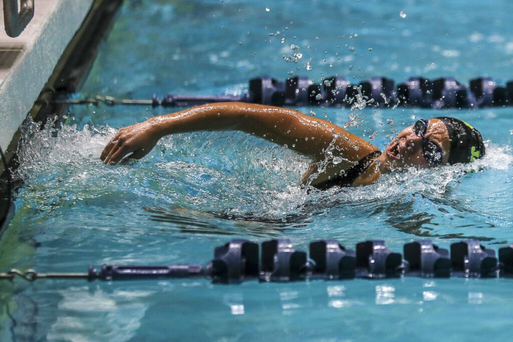 Jackson’s Olivia Hoyla swims in 200-yard individual medley during the Class 4A girls state swim and dive championships Saturday at King County Aquatic Center in Federal Way. (Annie Barker / The Herald)

