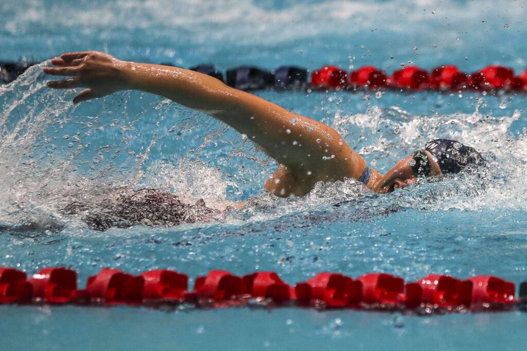 Glacier Peak’s Alena Lehmann swims in the 200-yard freestyle during the Class 4A girls state swim and dive championships Saturday at King County Aquatic Center in Federal Way. (Annie Barker / The Herald)
