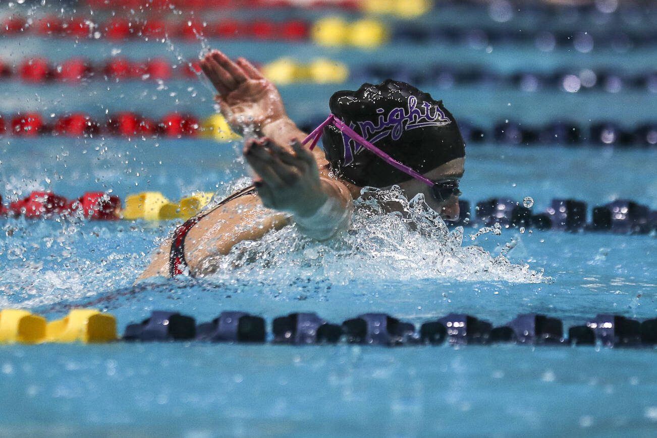 Kamiak’s Claire Smith swims in heat two of the 100 yard butterfly during the 4A girls state swim and dive championships at King County Aquatic Center in Federal Way, Washington on Saturday, Nov. 11, 2023. (Annie Barker / The Herald)