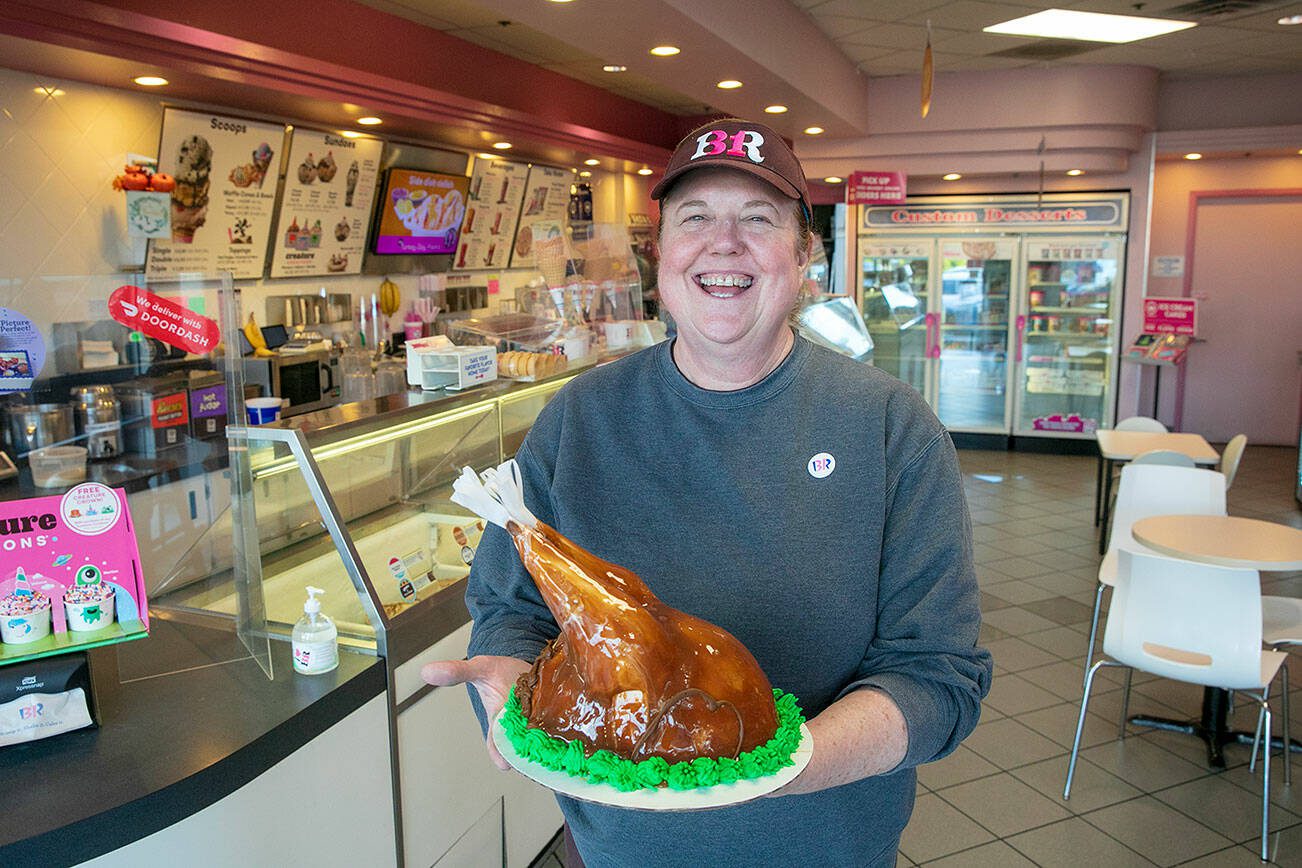 Cindy Buchan, owner of the Baskin-Robbins on Everett Mall Way, holds a turkey ice cream cake at her store on Wednesday, Nov. 15, 2023, in Everett, Washington. (Ryan Berry / The Herald)