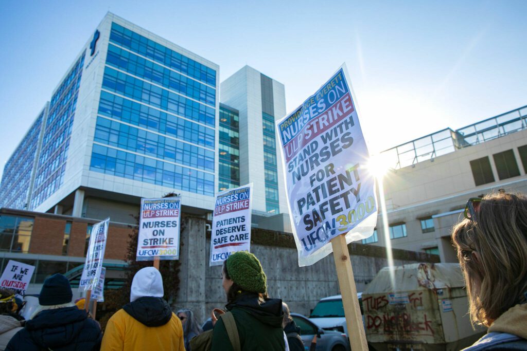 Providence nurses picket in front of the hospital during the first day of their planned five-day strike Tuesday, Nov. 14, 2023, at Providence Regional Medical Center in Everett, Washington. (Ryan Berry / The Herald)
