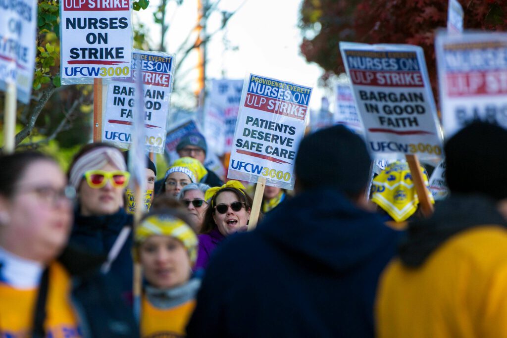Providence nurses picket in front of the hospital during the first day of their planned five-day strike Tuesday, Nov. 14, 2023, at Providence Regional Medical Center in Everett, Washington. (Ryan Berry / The Herald)
