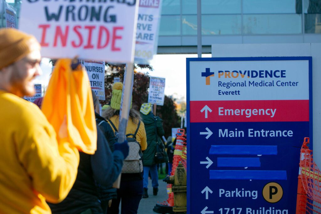 Providence nurses picket in front of the hospital during the first day of their planned five-day strike Tuesday, Nov. 14, 2023, at Providence Regional Medical Center in Everett, Washington. (Ryan Berry / The Herald)
