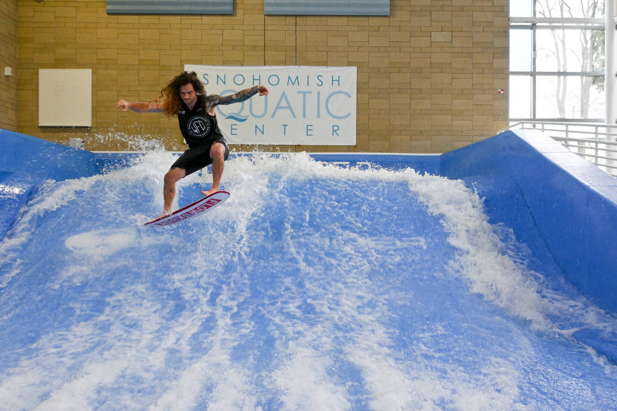 Scott Callens, who works as a FlowRider instructor at the Snohomish Aquatic Center, recently won world and national titles in flowboarding. (Ashley Choquette / Snohomish Aquatic Center)
