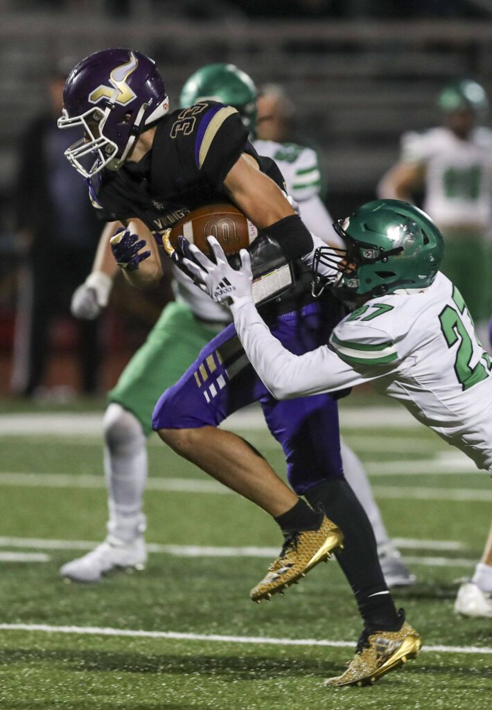 Lake Stevens’ David Brown (33) runs with the ball during a game against West Linn on Sept. 22 in Lake Stevens. (Annie Barker / The Herald)
