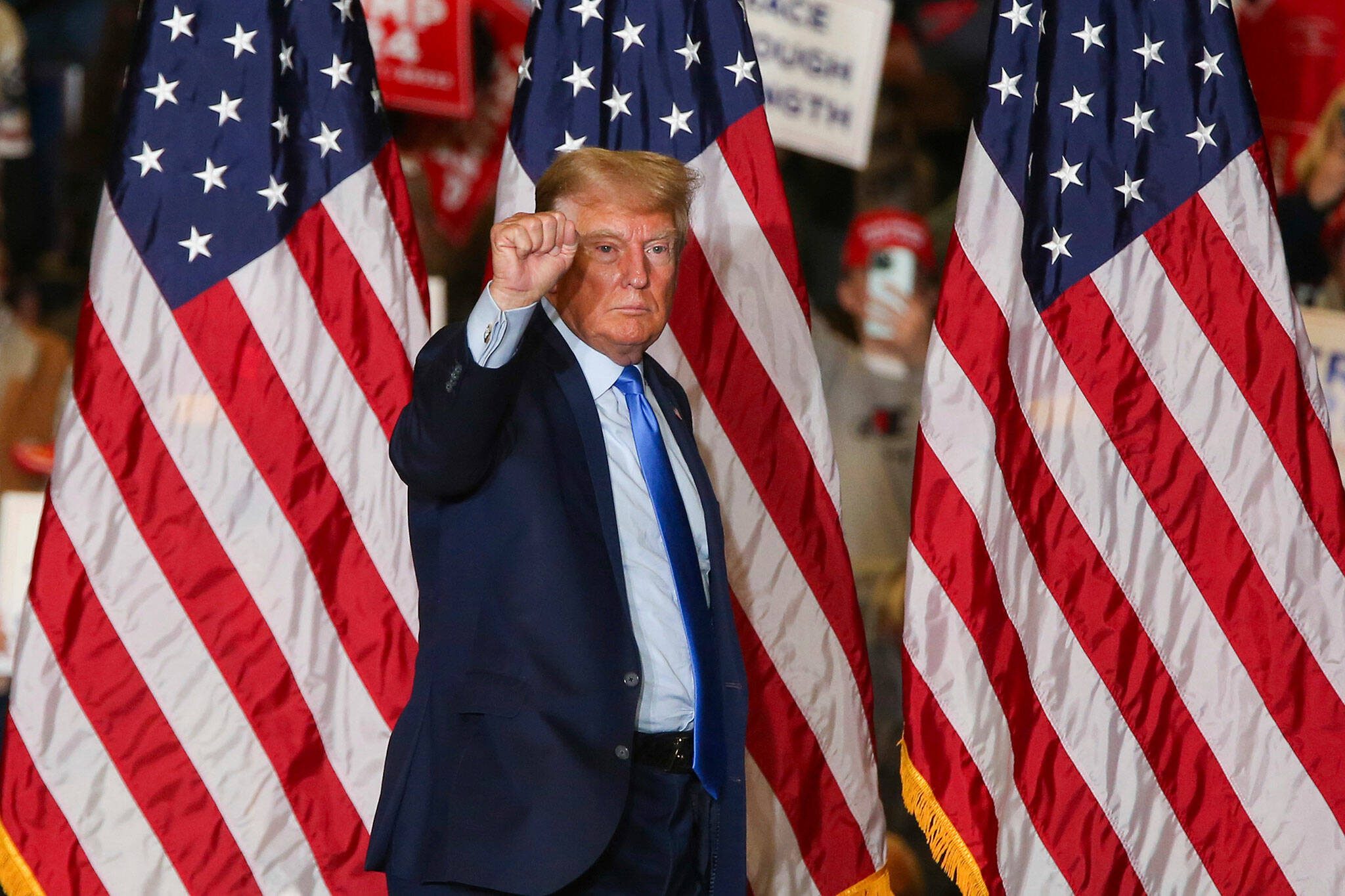 Former President Donald Trump leaves the stage at a campaign rally Saturday, Nov. 11, 2023, in Claremont, N.H. (AP Photo/Reba Saldanha)