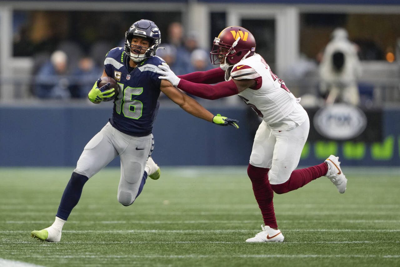 Seattle Seahawks wide receiver Tyler Lockett runs the ball against the Washington Commanders during a game Nov. 12 in Seattle. (AP Photo/Lindsey Wasson)