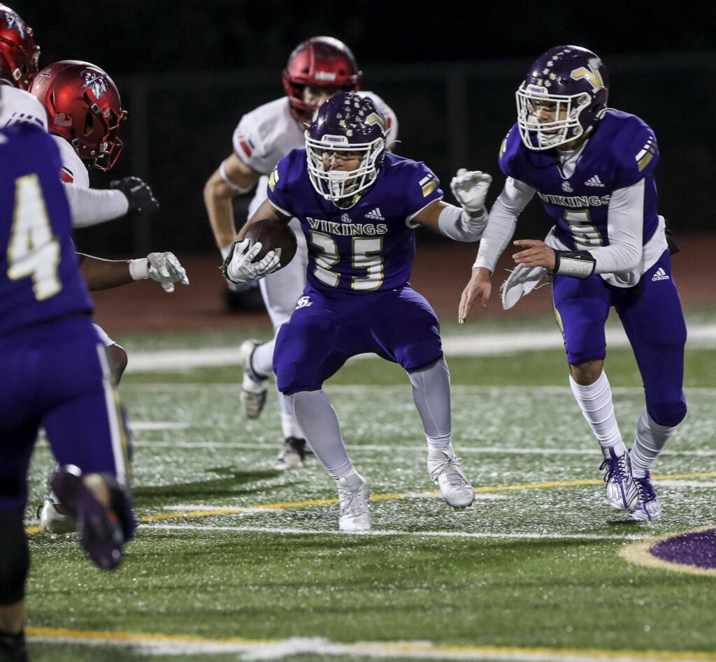 Lake Stevens’ Isaac Burks (25) moves with the ball during a game between Lake Stevens and Kennedy Catholic at Lake Stevens High School in Lake Stevens, Washington on Friday, Nov. 17, 2023. Lake Stevens won, 44-21. (Annie Barker / The Herald)
