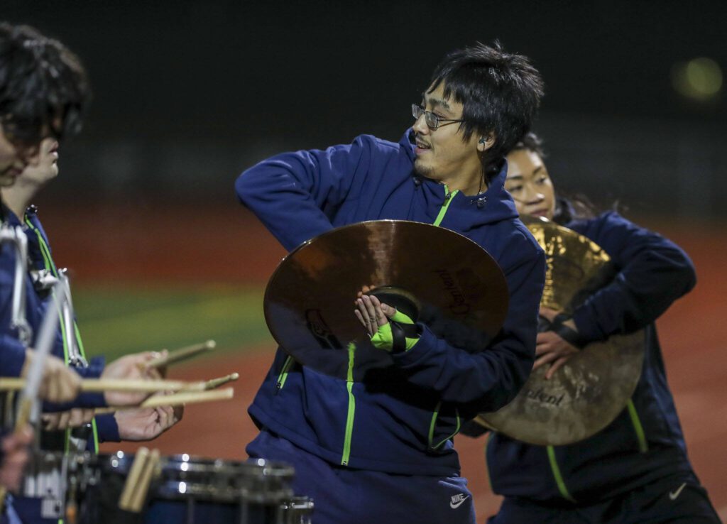 Seahawks Blue Thunder Drumline members perform during a game between Lake Stevens and Kennedy Catholic at Lake Stevens High School in Lake Stevens, Washington on Friday, Nov. 17, 2023. Lake Stevens won, 44-21. (Annie Barker / The Herald)
