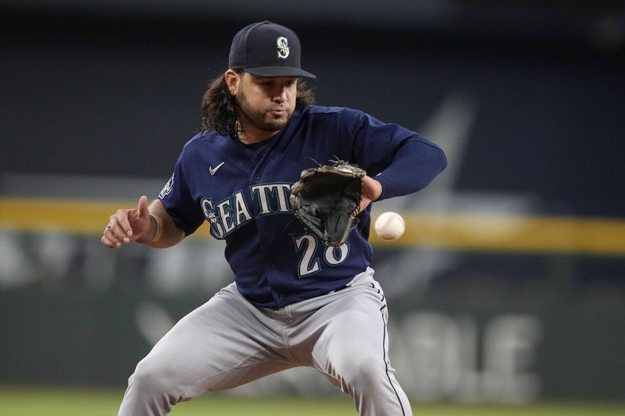 Seattle Mariners third baseman Eugenio Suarez fields a ground ball against the Texas Rangers during a game Sept. 24 in Arlington, Texas. (AP Photo/Tony Gutierrez)