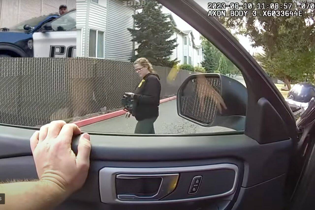 From the bodycam footage of Everett police officer Ryan Greely and footage from Molly Wright, Wright films officer Greely before he arrests her for obstructing a law enforcement officer on Aug. 10, 2023 in Everett, Washington. (Screenshot from a video provided by Molly Wright)