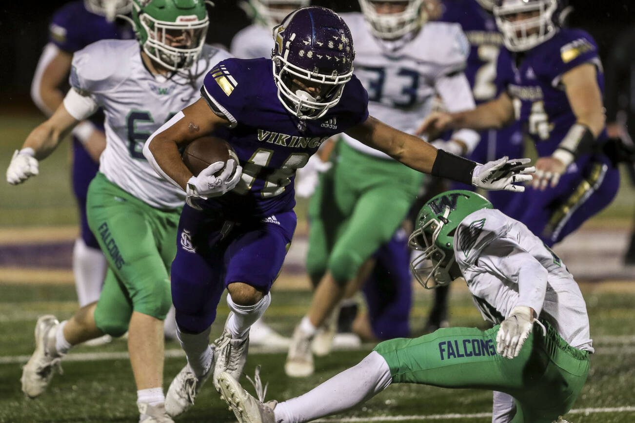 Lake Stevens’ Talha Rai (18) moves with the ball during a football game between Lake Stevens and Woodinville at Lake Stevens High School in Lake Stevens, Washington on Friday, Nov. 10, 2023. Lake Stevens won, 41-0. (Annie Barker / The Herald)