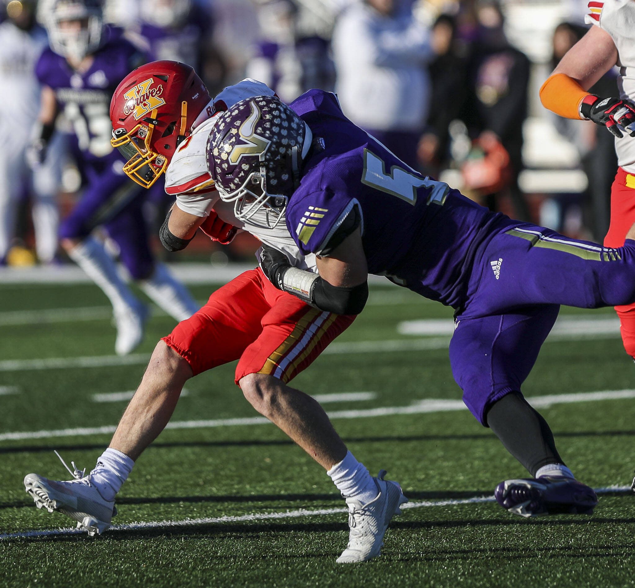 Lake Stevens’ Mason Turner (54) tackles during a Class 4A state semifinal game against Kamiakin on Saturday in Lake Stevens. Lake Stevens won 48-7. (Annie Barker / The Herald)
