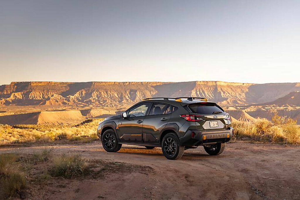 Prominent badging and anodized copper-finish accents are exterior features of the 2024 Subaru Crosstrek Wilderness small SUV. (Subaru)
