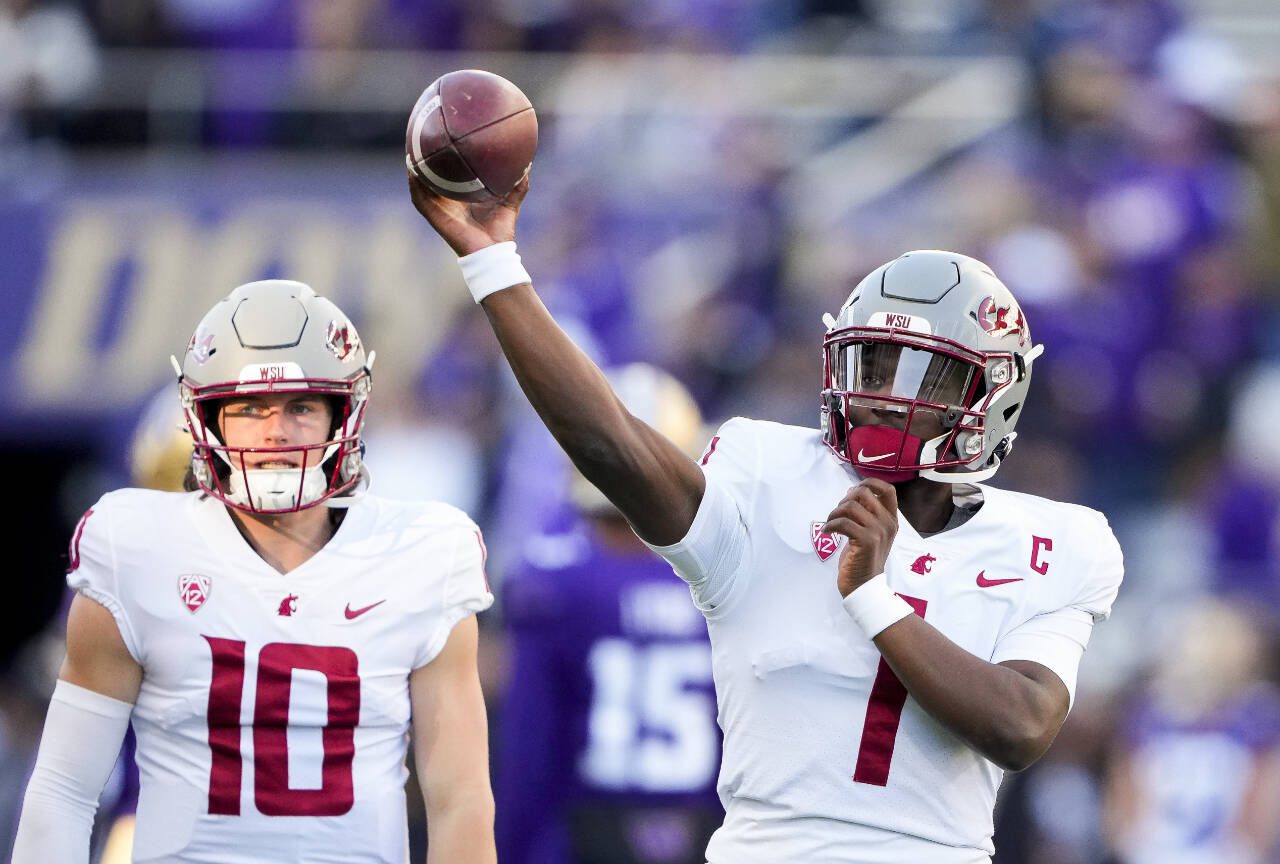 Washington State quarterback Cameron Ward (1) throws during warmups before a game against Washington on Nov. 25 in Seattle. (AP Photo/Lindsey Wasson)