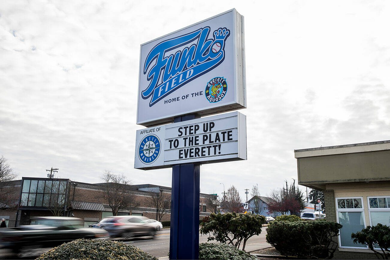A sign in front of the AquaSox front office references the upcoming Everett City Council vote on a sum of $1.1 million to give to outside contractors to help upgrade a new stadium on Wednesday, Nov. 29, 2023 in Everett, Washington. (Olivia Vanni / The Herald)