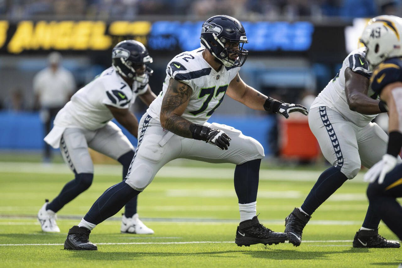 Seattle Seahawks offensive tackle Abraham Lucas (72) takes his stance during a game against the Los Angeles Chargers on Oct. 23, 2022, in Inglewood, Calif. (AP Photo/Kyusung Gong)