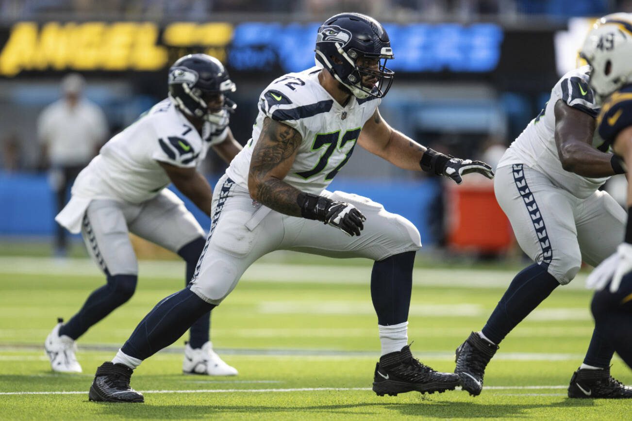 Seattle Seahawks offensive tackle Abraham Lucas (72) takes his stance during an NFL football game against the Los Angeles Chargers, Sunday, Oct. 23, 2022, in Inglewood, Calif. (AP Photo/Kyusung Gong)