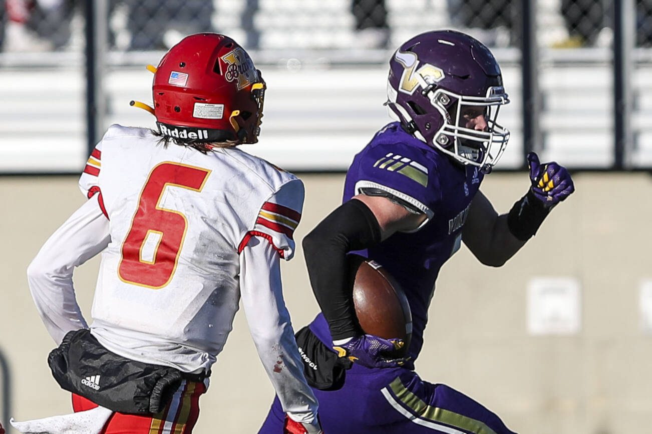 Lake Stevens’ Jaxson Lewis (8) runs with the ball during a Class 4A state semifinal game between Lake Stevens and Kamiakan at Lake Stevens High School in Lake Stevens, Washington on Saturday, Nov. 25, 2023. Lake Stevens won, 48-7. (Annie Barker / The Herald)