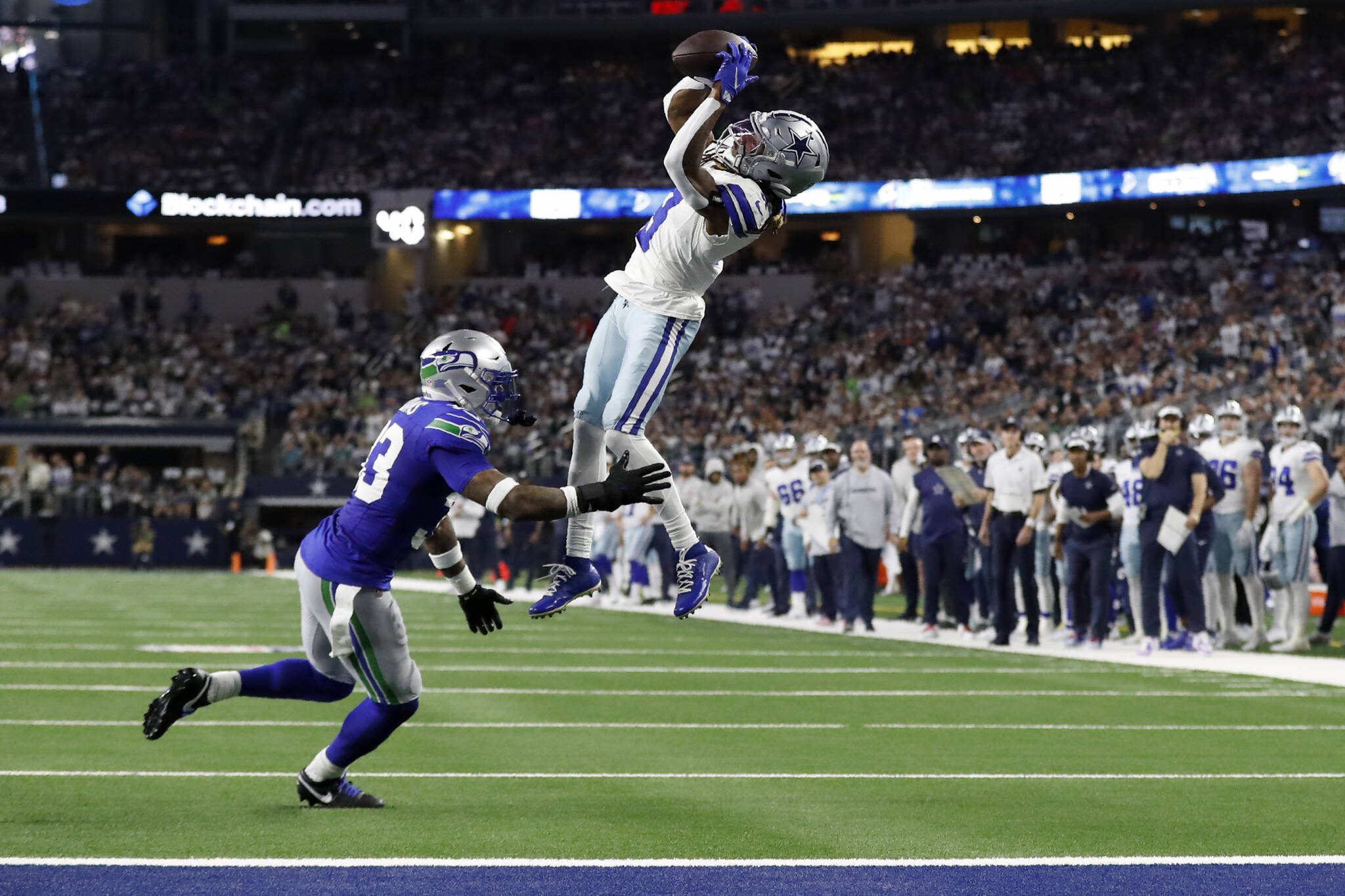 Dallas Cowboys wide receiver Brandin Cooks (3) catches a pass for a first down as Seattle Seahawks safety Jamal Adams (33) defends in the first half of Thursday’s game in Arlington, Texas. (AP Photo/Roger Steinman)