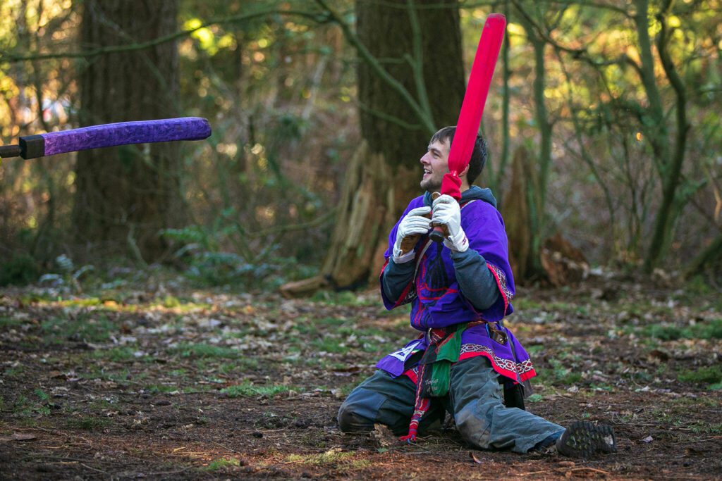Judson Day, persona Hated, hits the ground after being struck in the leg by a passerby who wanted to learn about Amtgard during a weekly meeting of the Amtgard LARPing group The Hollow on Jan. 29, at McCollum Park. (Ryan Berry / The Herald)
