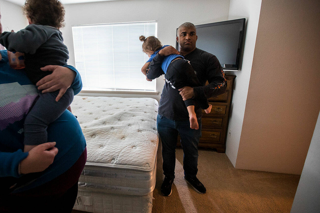 Max Redman, his partner and their children in their empty bedroom that was one of the main rooms of their apartment with the maggot infestation on Thursday, Sept. 28, 2023 in Everett, Washington. (Olivia Vanni / The Herald)