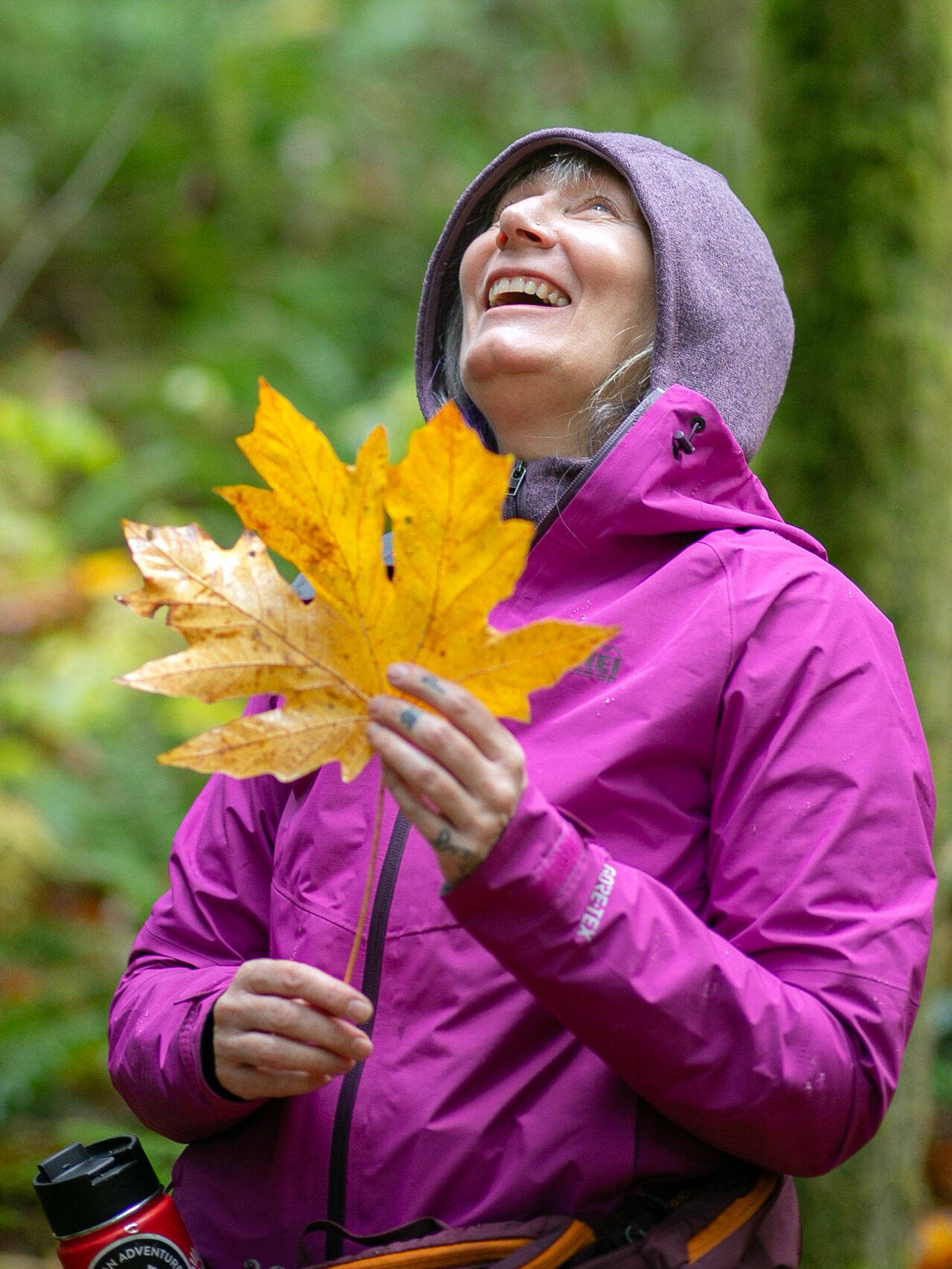 Alexis Burroughs encourages participants to connect with their senses one-by-one while leading a forest bathing session Sunday, Nov. 19, 2023, at Lord Hill Regional Park near Snohomish, Washington. (Ryan Berry / The Herald)
