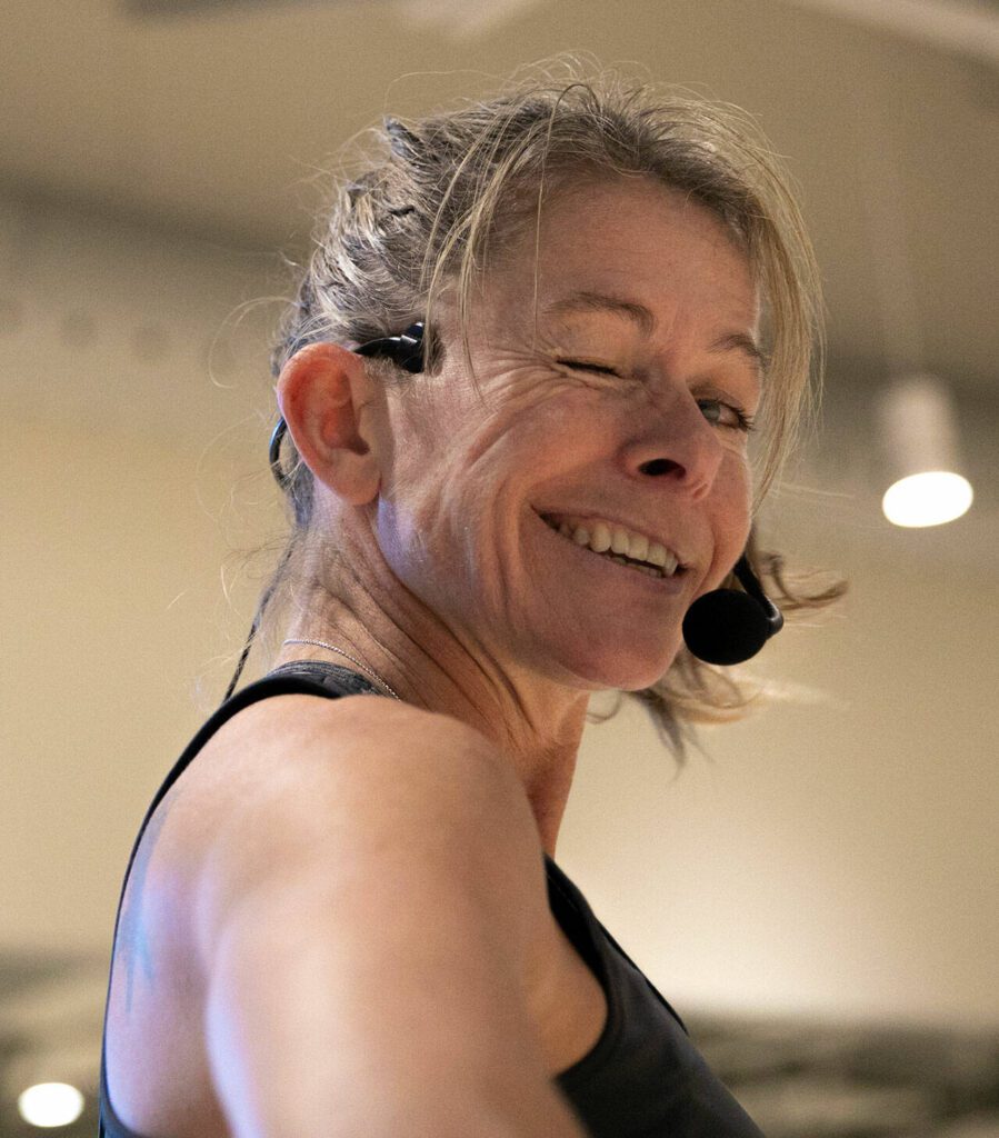 Instructor Gael Gebow turns and gives the camera a wink during her Boot Camp fitness class Monday, Nov. 13, 2023, at the YMCA in Everett, Washington. (Ryan Berry / The Herald)
