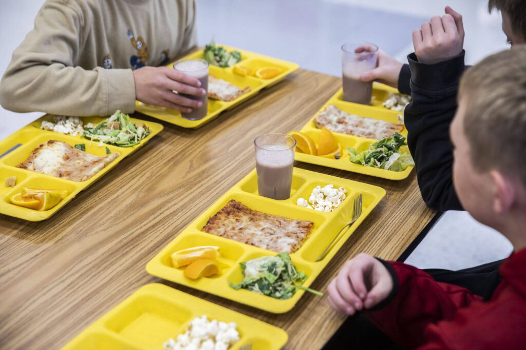 Darrington Elementary School students drink cups of chocolate milk with their lunches on Monday, Nov. 20, 2023 in Darrington, Washington. (Olivia Vanni / The Herald)
