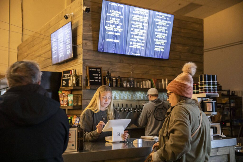 Customers order beer at Haywire Brewing Company on Wednesday, Nov. 29, 2023 in Snohomish, Washington. (Olivia Vanni / The Herald)
