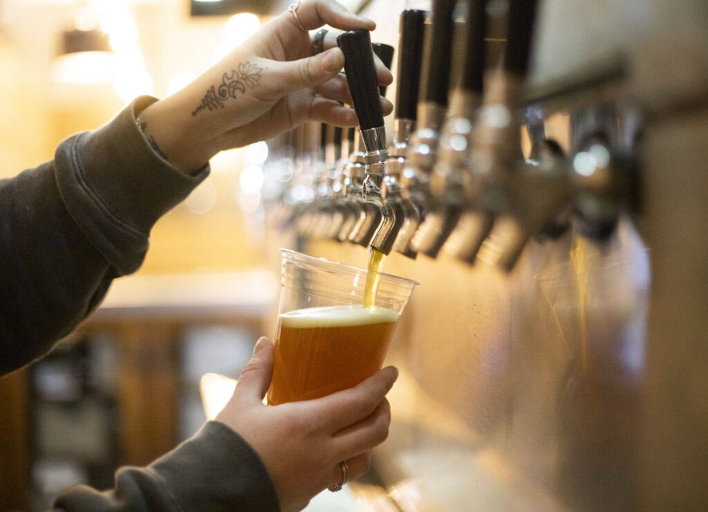 A beer is poured at Haywire Brewing Company on Wednesday, Nov. 29, 2023 in Snohomish, Washington. (Olivia Vanni / The Herald)
