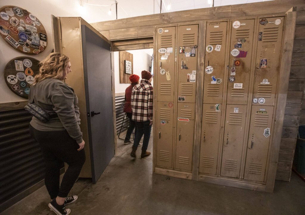 A secret speakeasy door to the 21 and up section of Haywire Brewing Company on Wednesday, Nov. 29, 2023 in Snohomish, Washington. (Olivia Vanni / The Herald)
