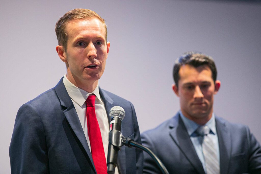 Snohomish County Councilmember Nate Nehring, left, speaks alongside Councilmember Jared Mead during the pair’s Building Bridges Summit on Monday, Dec. 4, 2023, at Washington State University Everett in Everett, Washington. (Ryan Berry / The Herald)
