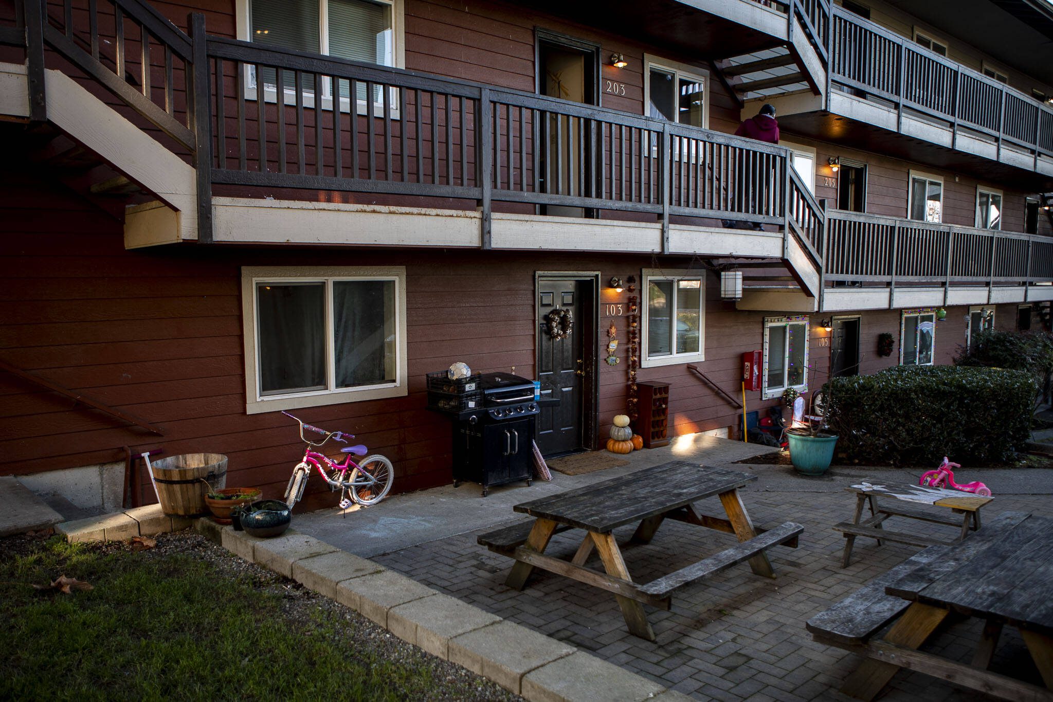 Bikes and toys line the Riverdale Apartments in Everett, Washington on Tuesday, Nov. 28, 2023. There was a shooting across the street on Sunday. (Annie Barker / The Herald)