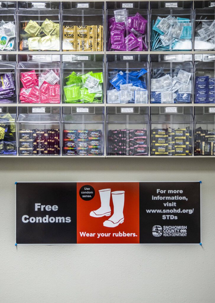 The “condom wall” inside the the STI clinic on Friday, Dec. 1, 2023 in Everett, Washington. (Olivia Vanni / The Herald)
