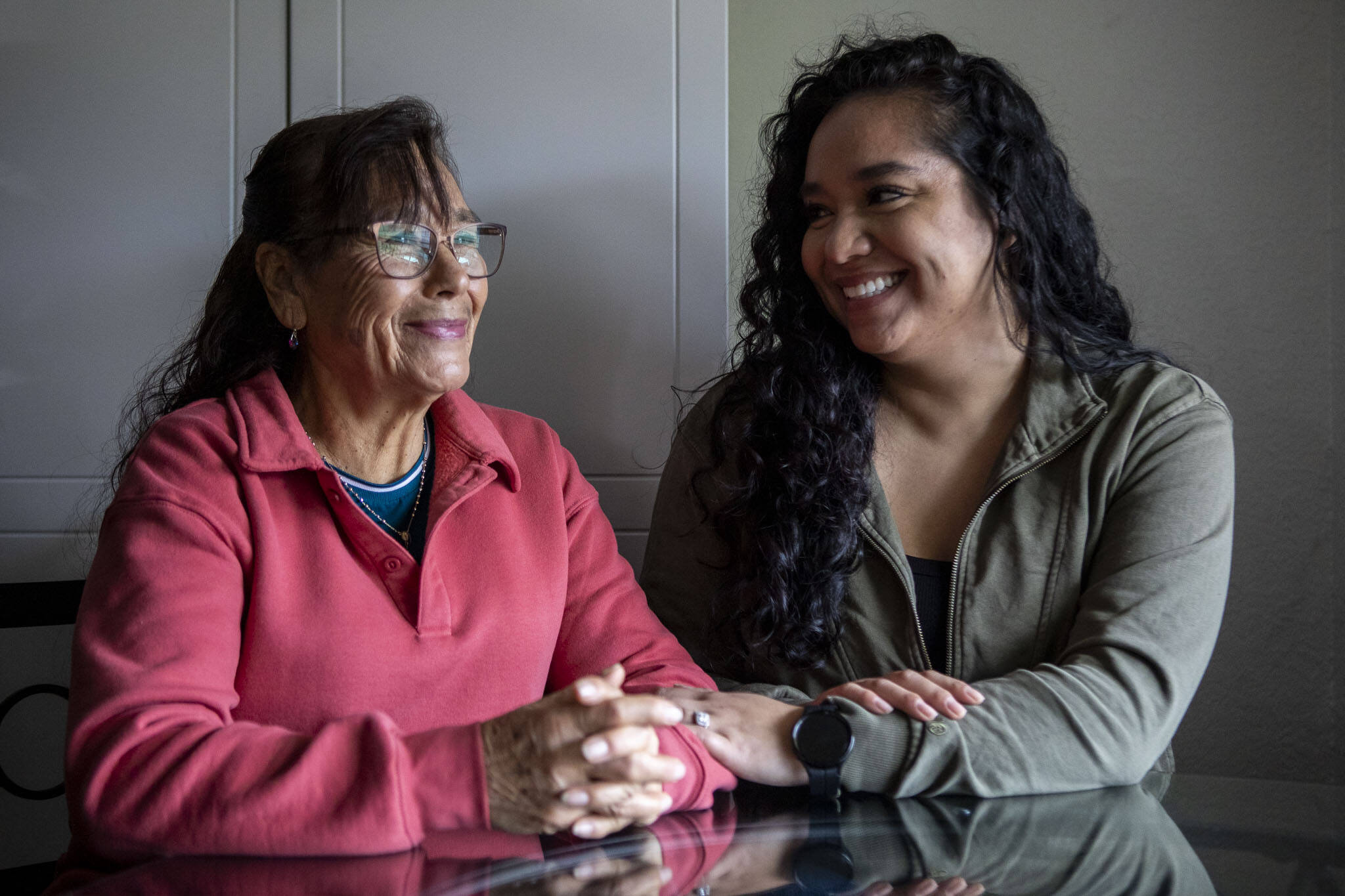Elizabeth Cervantes, right, and her mother Maria Jimenez, left, pose for a photo at their home in Burlington, Washington on Wednesday, Dec. 6, 2023. (Annie Barker / The Herald)