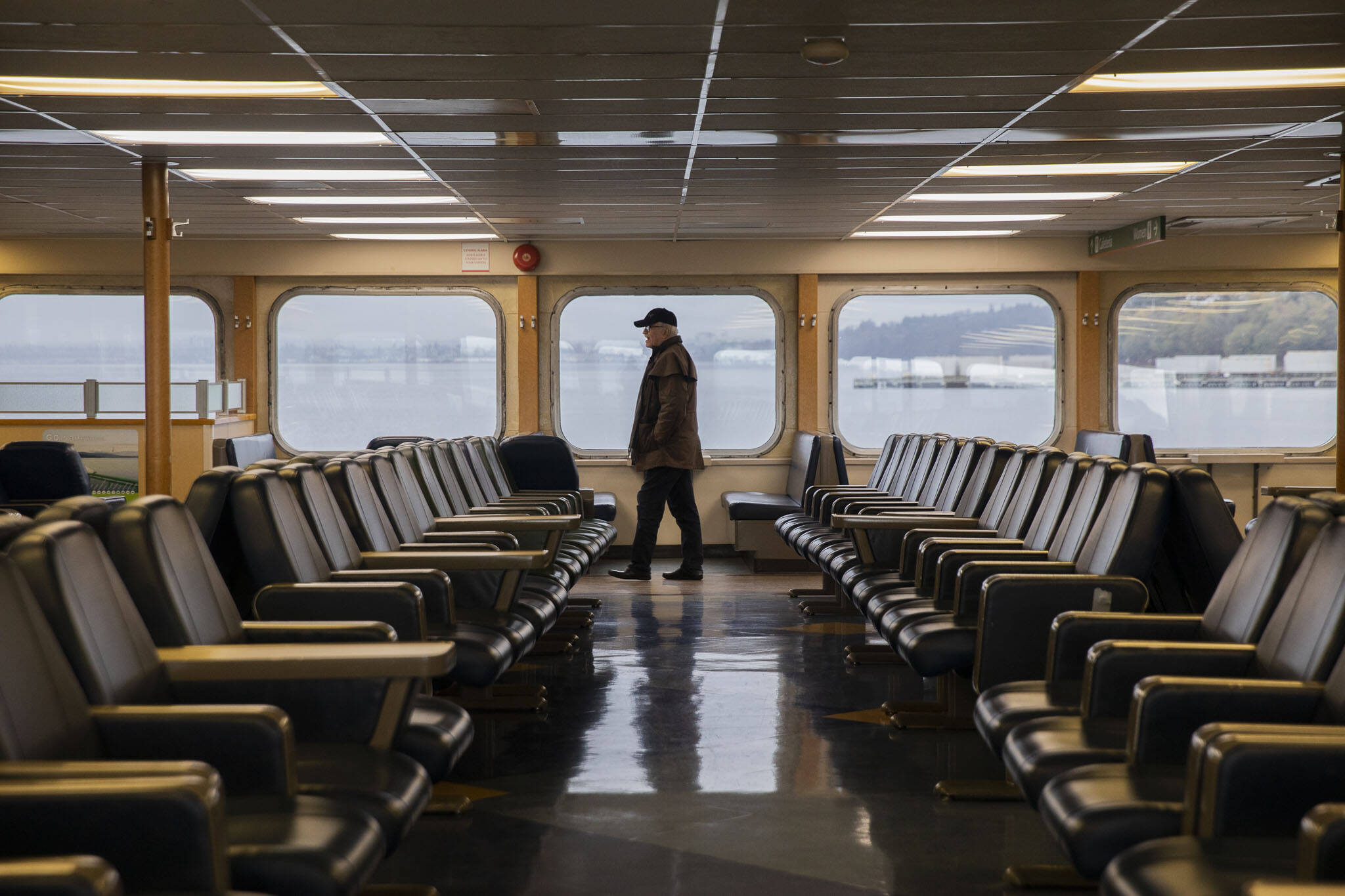 A man walks through the M/V Kitsap on Friday, Dec. 1, 2023 in Mukilteo, Washington. (Olivia Vanni / The Herald)