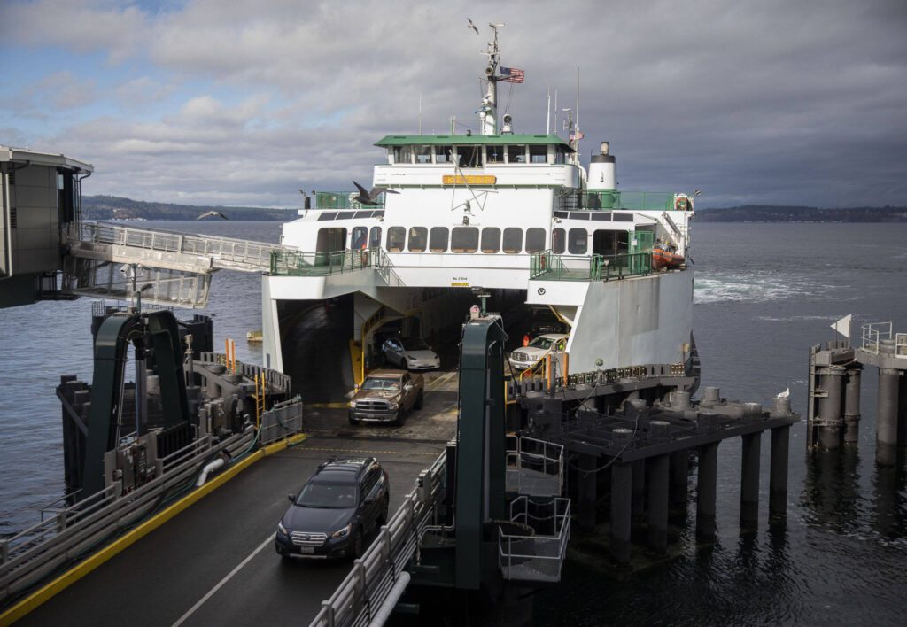 Cars disembark the M/V Kitsap on Friday, Dec. 1, 2023 in Mukilteo, Washington. (Olivia Vanni / The Herald)
