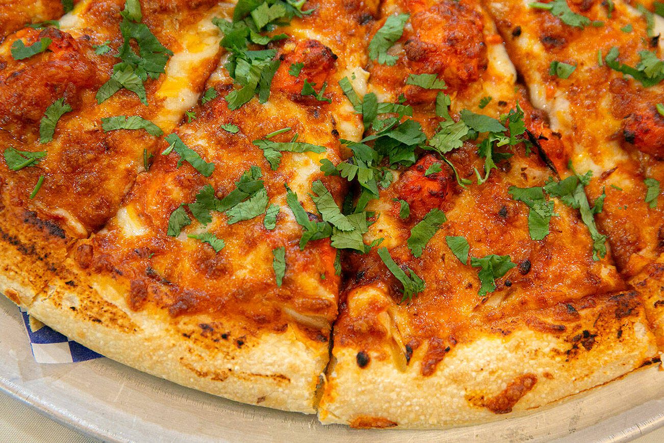 Butter Chicken Pizza at Tasty Curry on Wednesday, Dec. 6, 2023, in Everett, Washington. (Ryan Berry / The Herald)