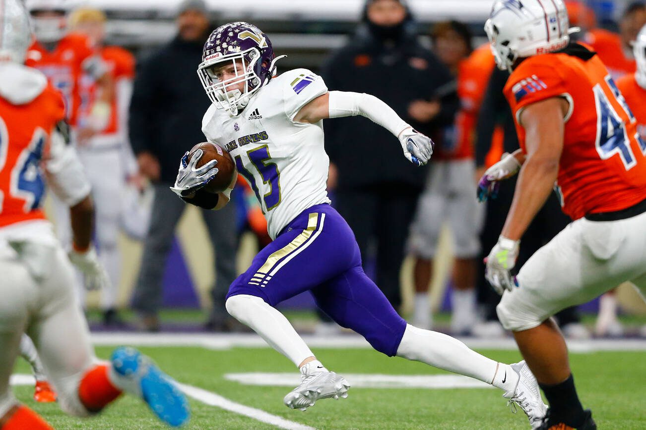 Lake Stevens senior Jesse Lewis takes a short pass all the way for a first half touchdown against Graham-Kapowsin during the WIAA 4A Football State Championship on Saturday, Dec. 2, 2023, at Husky Stadium in Seattle, Washington. (Ryan Berry / The Herald)