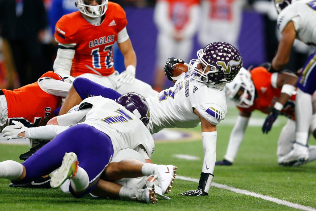 Lake Stevens’ Steven Lee Jr. goes to the ground after returning a kick against Graham-Kapowsin during the WIAA 4A Football State Championship on Saturday, Dec. 2, 2023, at Husky Stadium in Seattle, Washington. (Ryan Berry / The Herald)
