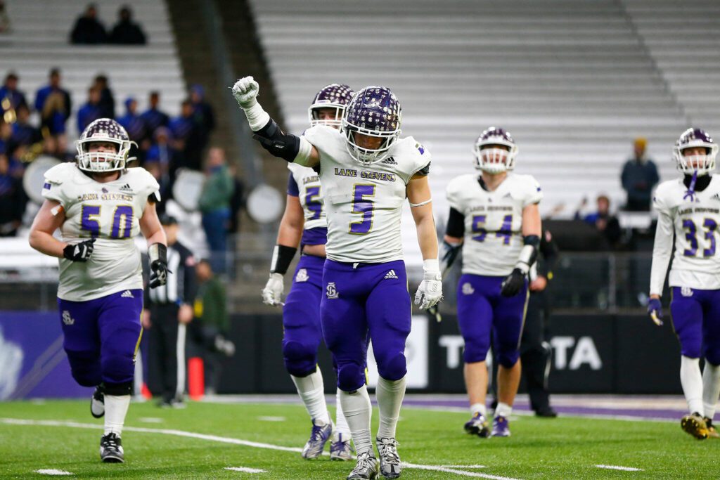 The Lake Stevens’ defense comes off the field after forcing a fourth quarter turnover on downs against Graham-Kapowsin during the WIAA 4A Football State Championship on Saturday, Dec. 2, 2023, at Husky Stadium in Seattle, Washington. (Ryan Berry / The Herald)
