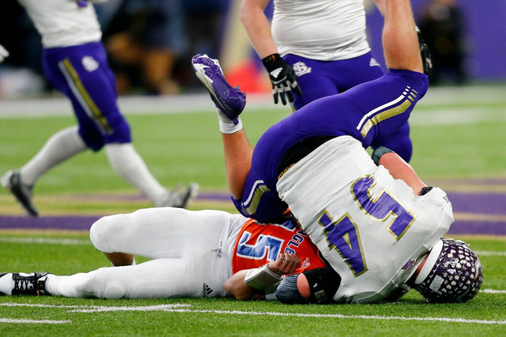 Lake Stevens linebacker Mason Turner takes down the ballcarrier against Graham-Kapowsin during the WIAA 4A Football State Championship on Saturday, Dec. 2, 2023, at Husky Stadium in Seattle, Washington. (Ryan Berry / The Herald)
