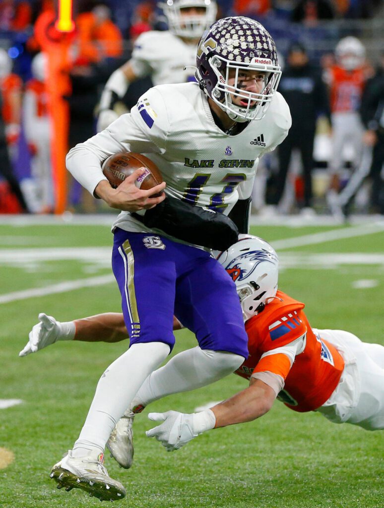 Lake Stevens quarterback Kolton Matson keeps it himself for a long first half run against Graham-Kapowsin during the WIAA 4A Football State Championship on Saturday, Dec. 2, 2023, at Husky Stadium in Seattle, Washington. (Ryan Berry / The Herald)
