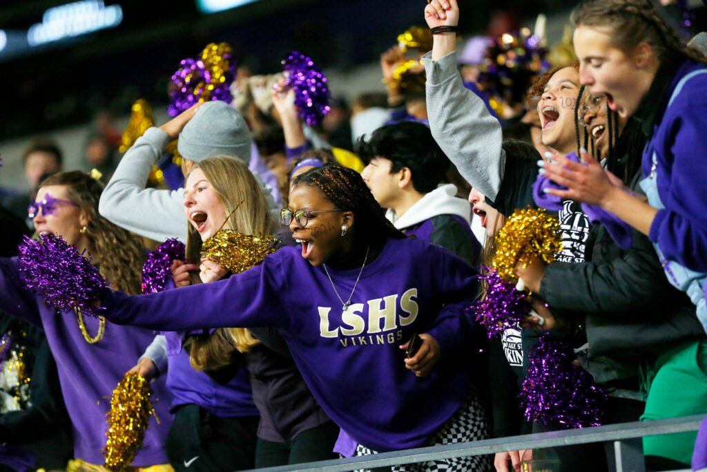 The Lake Stevens student section goes wild during a cheer led by the cheer squad during the WIAA 4A Football State Championship on Saturday, Dec. 2, 2023, at Husky Stadium in Seattle, Washington. (Ryan Berry / The Herald)
