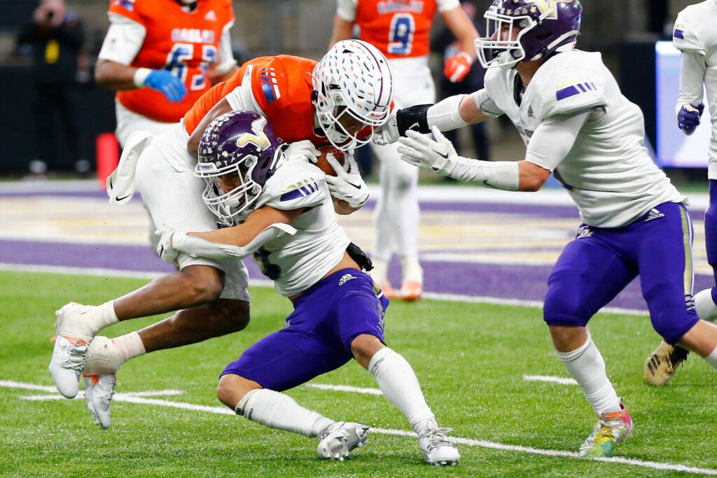 Lake Stevens’ Paul Varela takes down the ballcarrier against Graham-Kapowsin during the WIAA 4A Football State Championship on Saturday, Dec. 2, 2023, at Husky Stadium in Seattle, Washington. (Ryan Berry / The Herald)
