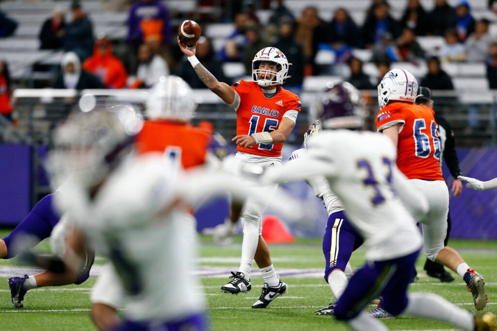 Graham-Kapowsin quarterback Daveon Superales throws into coverage against Lake Stevens during the WIAA 4A Football State Championship on Saturday, Dec. 2, 2023, at Husky Stadium in Seattle, Washington. (Ryan Berry / The Herald)
