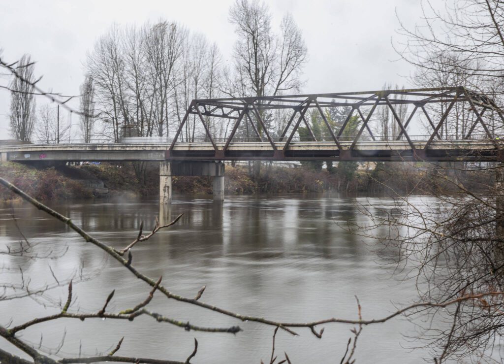 The Snohomish River flows underneath the Airport Way bridge on Monday, Dec. 4, 2023 in Snohomish, Washington. (Olivia Vanni / The Herald)
